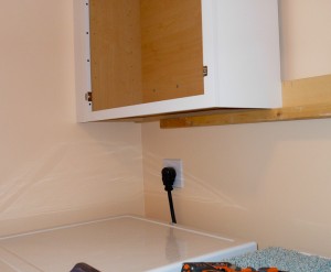 installing cabinets using a temporary support rail