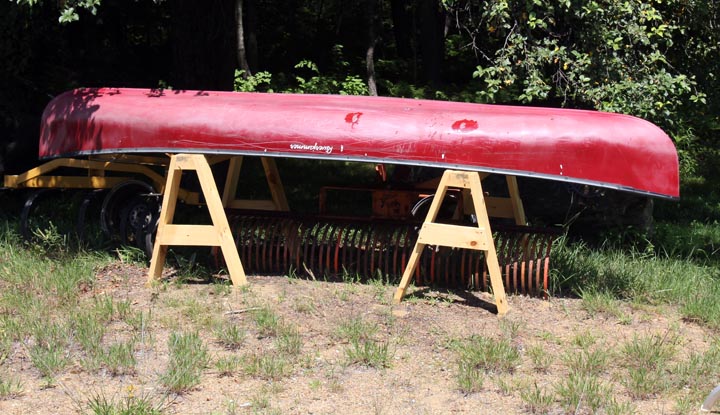 canoe on wooden canoe stands